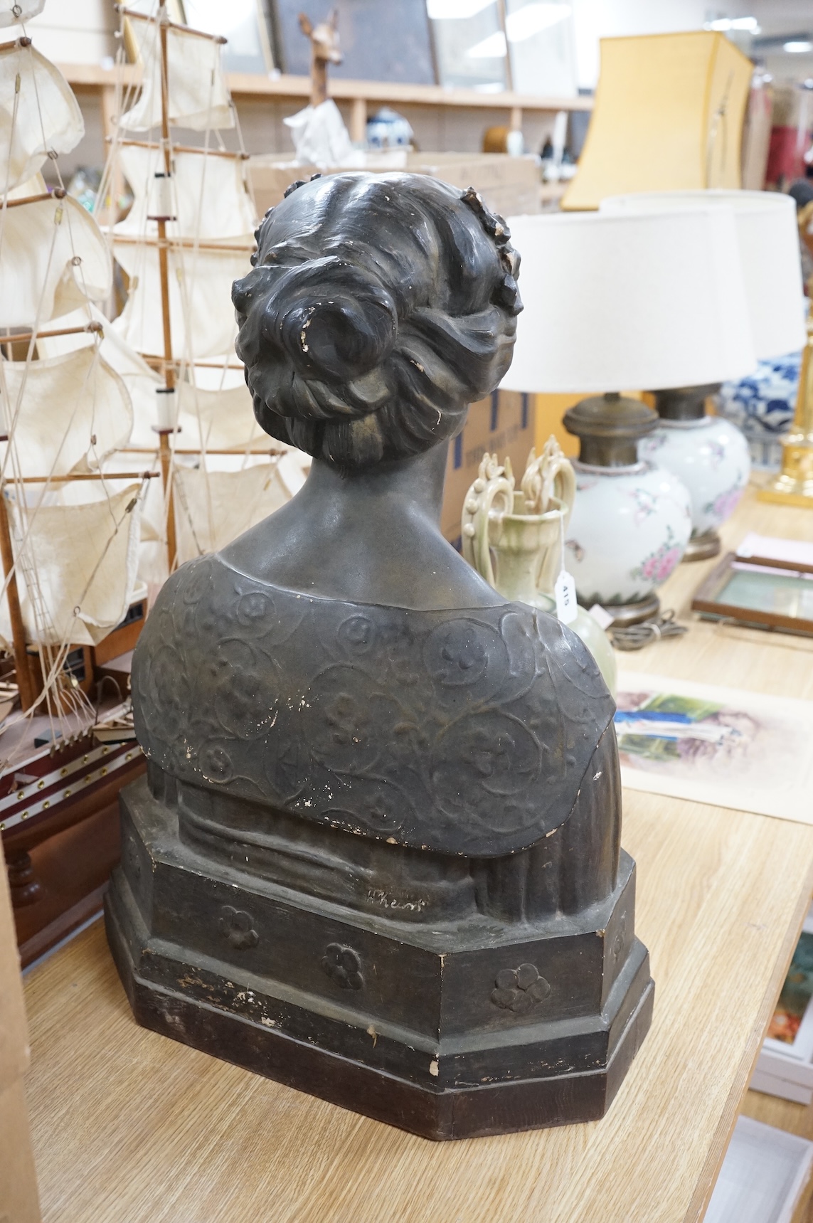An early 20th century bronzed plaster bust 